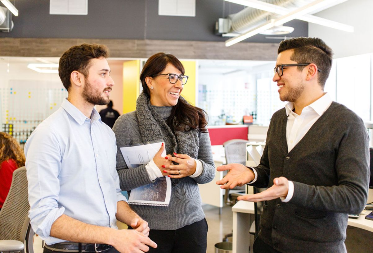 grads-block-1.jpg Three office employees talking