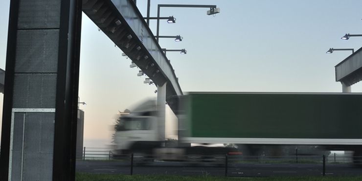 Lorry passing under toll gate