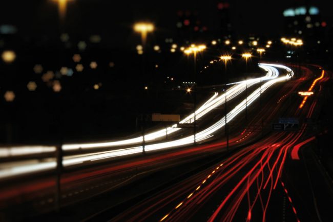 Highway with light trails from cars